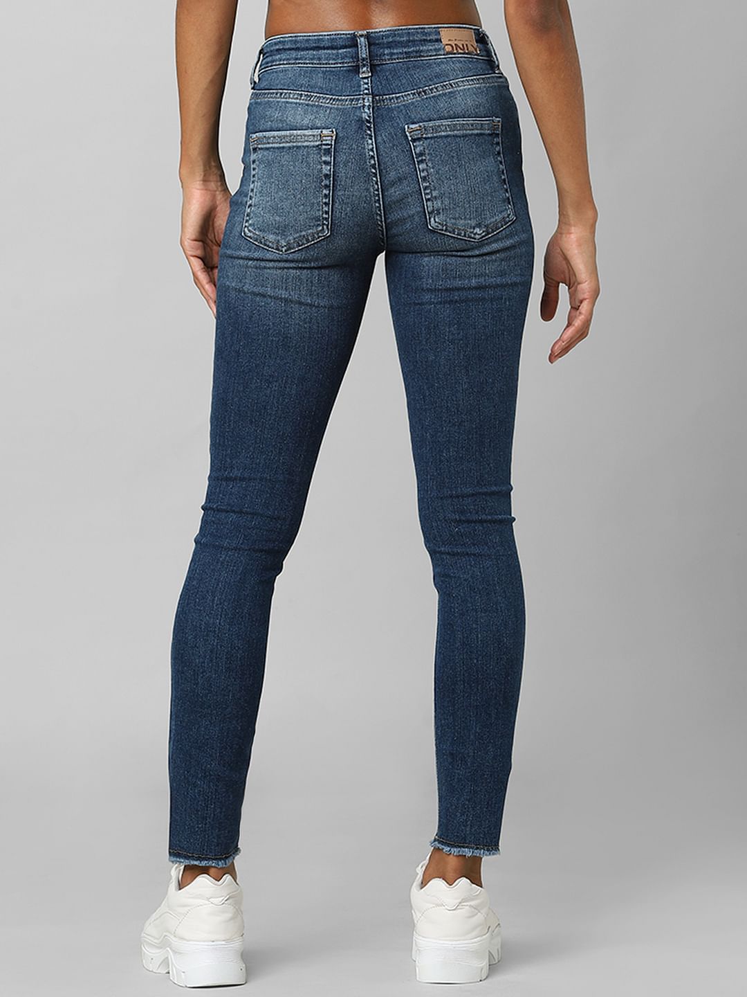 Blue Mid Rise Raw Edge Skinny Jeans