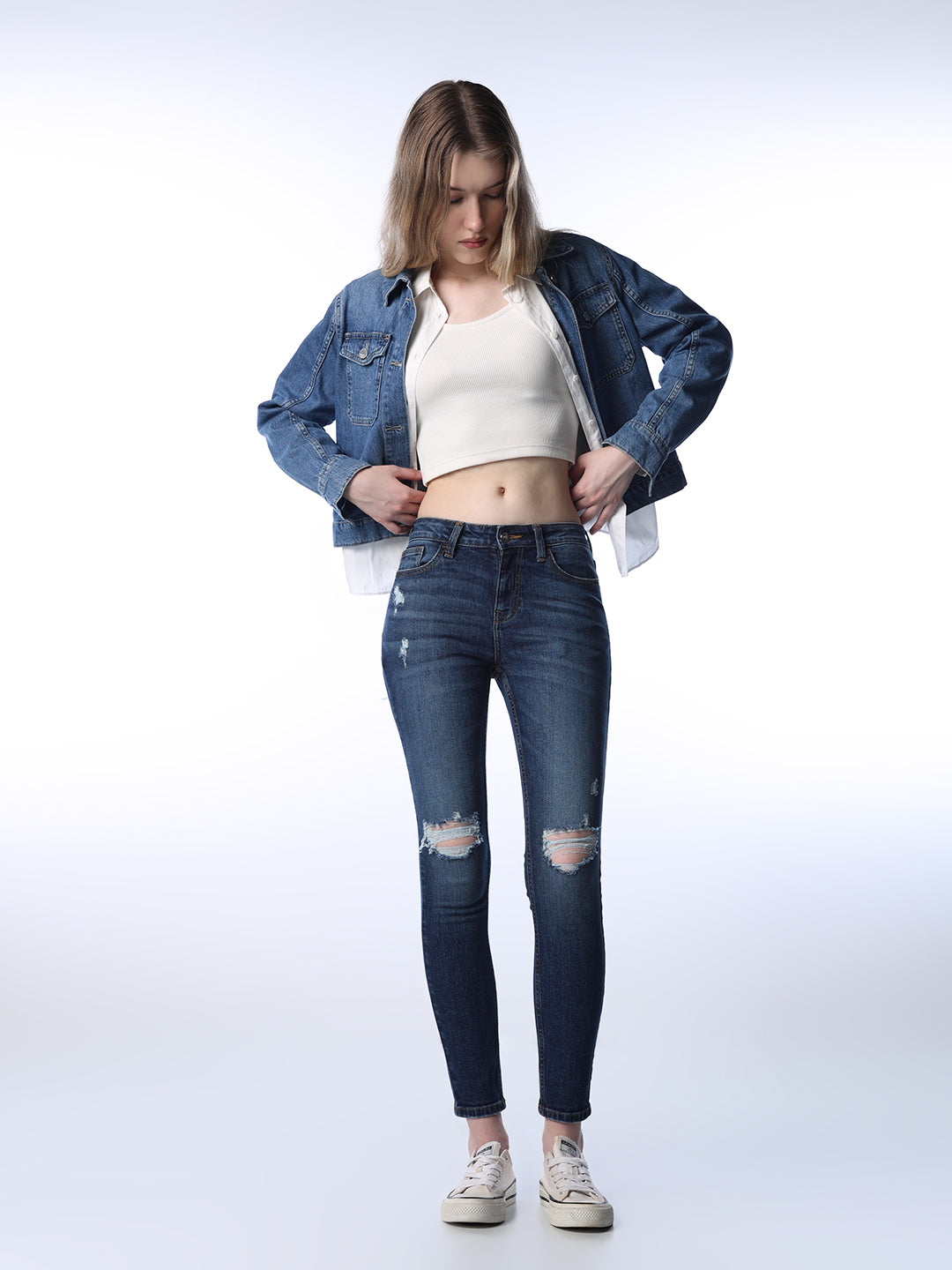 Mid Rise Distressed Skinny Jeans